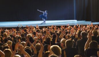 Ballerina bowing on stage