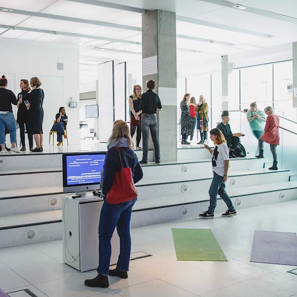 Students exploring a demonstrator exhibition