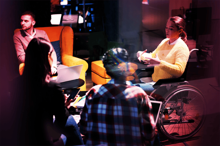 Disabled Student: Red Tint A disabled student talking to her peers, red tint over image.