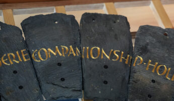 Slate from the Spirit Case sculpture displaying the words 'companionship'