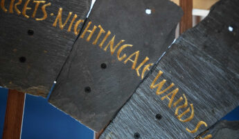 Slate from the Spirit Case sculpture displaying the words 'nightingale ward'