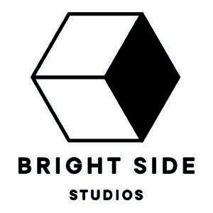A logo featuring a black and white geometric cube with the name "Bright Side Studios" written below in bold, uppercase letters.